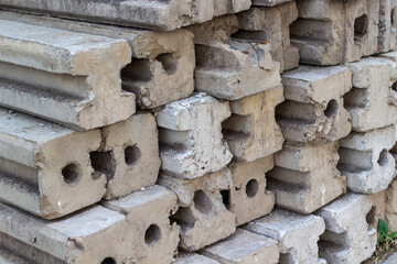 Stacked precast concrete elements detail for construction industry showcasing structural forms patterns and textures displaying prefabrication material for durable support background