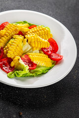 Corn salad tomato fresh vegetables snack fresh delicious gourmet food background on the table  rustic food top view copy space keto and paleo diet vegetarian and vegan food