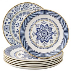 A stack of decorative ceramic plates with intricate blue floral patterns and gold trim. The plates are arranged in a neat pile, showcasing their elegant designs.