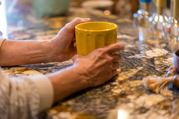 Hands on a coffee tea mug