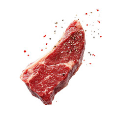 A seasoned beef steak floats against a black background with spices falling around it