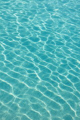 Fototapeta premium Turquoise Ocean Water with Sunlight Reflections – Aquatic Texture (AI Generated)
