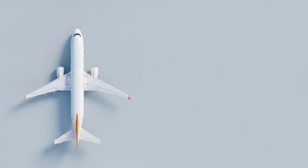 Top View of a White Passenger Airplane on a Light Blue Background
