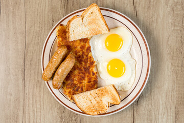 Two eggs with hash browns and sausage
