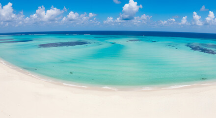 Fototapeta premium Stunning aerial panorama of an empty white sand beach, clear turquoise water, and a deep blue ocean.