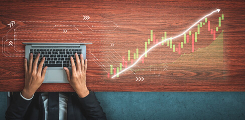 Businessman Analyzing Financial Data on Laptop with Stock Market Graph Overlay in Modern Workspace Impute.
