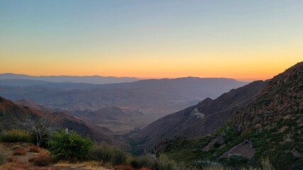 Vast Desert Valley and Mountain Ranges at Sunset Glow in Southern California Wilderness