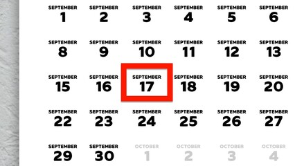 Close-up of the date September 17th marked with a red cursor on the wall calendar 2025