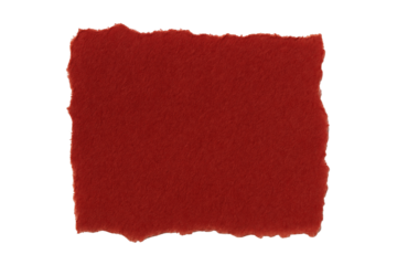 Roughly Torn Red Paper Fragment with Textured Surface Displayed Against a Stark Black Void