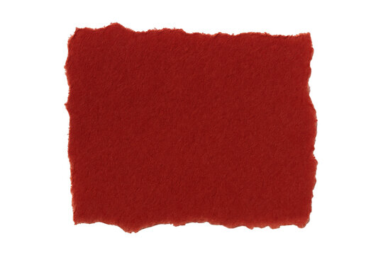 Roughly Torn Red Paper Fragment with Textured Surface Displayed Against a Stark Black Void