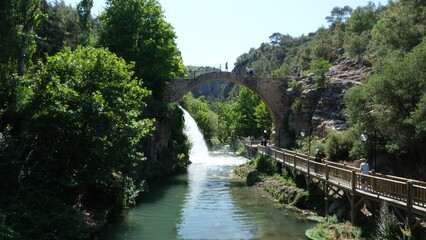 Clandras Bridge, an ancient stone arch bridge built by the Phrygians around 2,500 years ago over the Banaz Stream, located in Karahallı district of Uşak, Turkey, with a scenic waterfall 