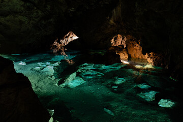The subterranean world of Bozkov Dolomite Caves (Bozkovske dolomitove jeskyne) features the largest underground lake in the Czech Republic, filled with exceptionally clear water