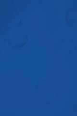 Macro abstract of large transparent bubbles on a deep navy blue background, creating a clean and elegant look