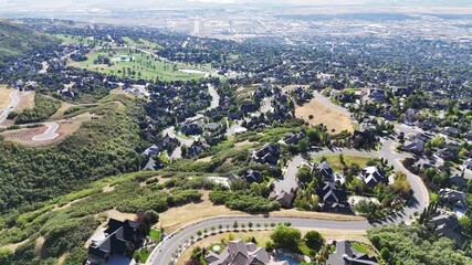 Aerial view of suburban homes nestled in the green hills of Bountiful, Utah