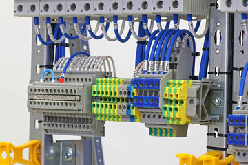 Electrical screw terminals for connecting wires in an electrical switchboard. Soft focus. Close-up.