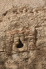 loophole in a worn wall of the Alhambra