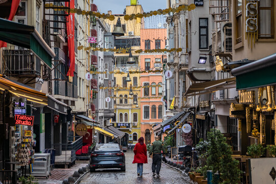 A colorful alley near Istiklal Avenue with a couple walking in Istanbul, Turkey