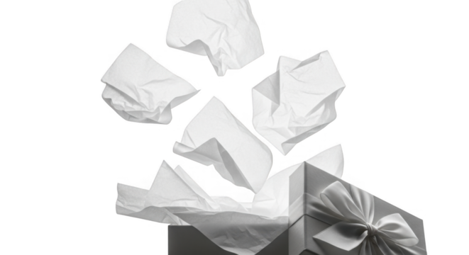 Crumpled white paper tissues flying out of an open cardboard box isolated on a black background