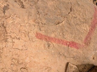 Red marking on rock surface