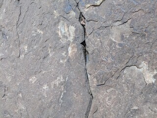 Natural rock texture with a visible crack