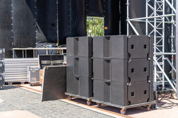 Professional acoustic systems prepared for installation on a modern concert stage