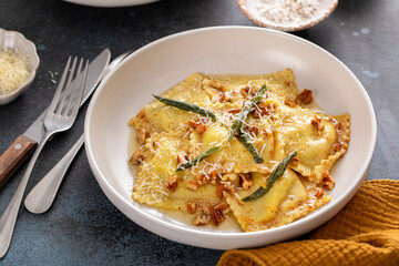Pumpkin ravioli with brown butter pecan sauce and sage