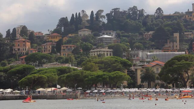 People Swimming and Relaxing on Rapallo Beach, Liguria, Italy - 4K