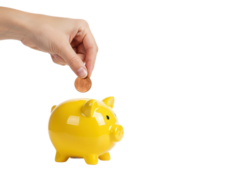 Saving money hand inserting coin into yellow piggy bank indoor bright setting perspective. Cut out png