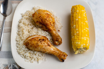 chicken drumsticks with rice and  corn