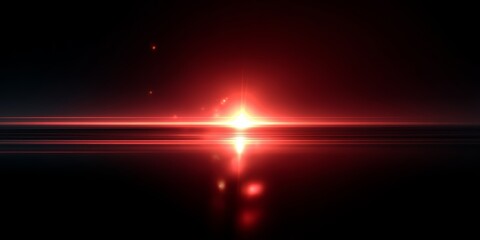 Red light is shining on the water. The light is bright and it is reflecting on the water