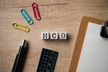 There is wood cube with the word HCD. It is an abbreviation for Human Centered Design as eye-catching image.