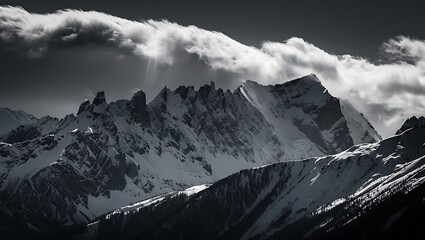 Dramatic Black and White Landscape of Snow Capped Mountains Under Cloudy Sky Majestic Peaks