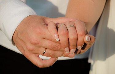 bride and groom holding hands