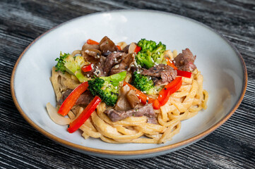 Top view of pasta with beef and broccoli. 