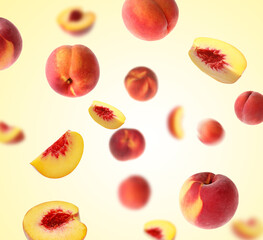 Fresh peaches whirling in air against yellow gradient background