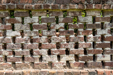 Historic Brick Lattice Wall. Lattice brick wall at Middleton Place Plantation, built with reclaimed bricks from the mansion ruins burned in 1865 during the Civil War.