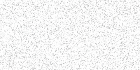 Abstract background of small irregular gray and white shapes creating a textured pattern and neutral aesthetic design