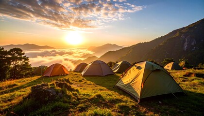 Camping Tents on Grassy Hill at Sunrise with Mountain Views