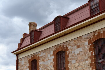 Obraz premium Barred windows of old prison facility.