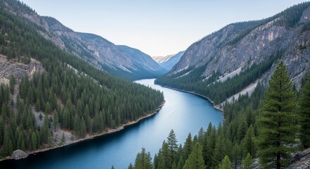 Serene Blue River Winding Through Pine-Covered Mountains Under a Clear Sky