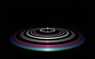 Fototapeta premium A photorealistic image of concentric circular ripples on a black background. 