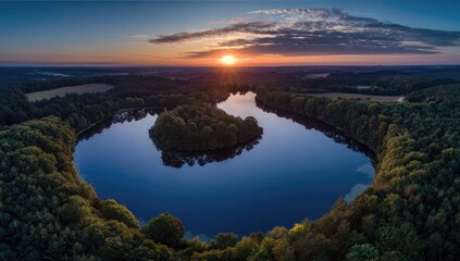 Fototapeta premium Serene lake curves under a vibrant sunset