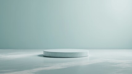 Minimalist light blue podium on a textured surface with soft lighting