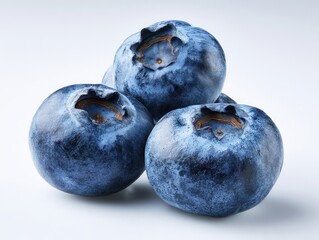 Obraz premium Close-up of three blueberries