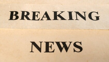 Urgent breaking news headline printed on a vintage newspaper, a classic media concept for an important announcement