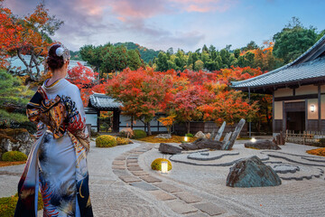 Japanese Woman in Traditional Kimono Dress at Enko-ji temple with beautiful foliage in autumn in Kyoto, Japan