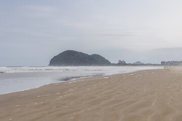paradisiac beach in Bertioga São Paulo, with cloudy sky a beautiful and calm place.