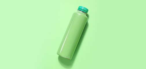 Bottle of soda on green background. Mockup for design