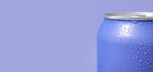 Can of soda on purple background with space for text, closeup