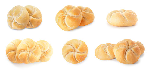 Set of delicious kaiser rolls on white background